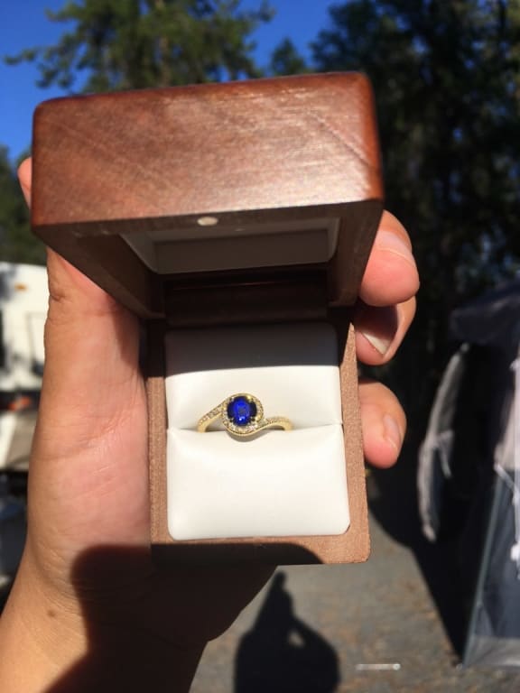 Oval diamond ring on hand