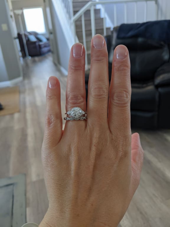 Oval diamond ring on hand