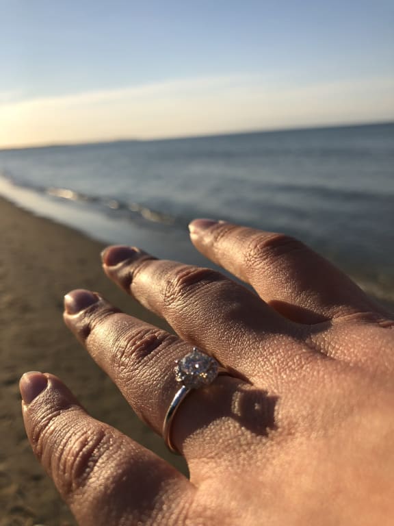 Oval diamond ring on hand