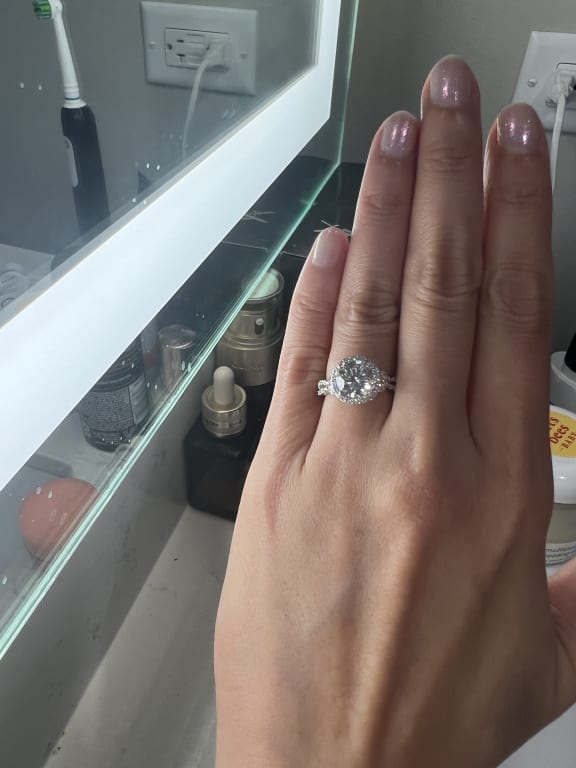 Oval diamond ring on hand