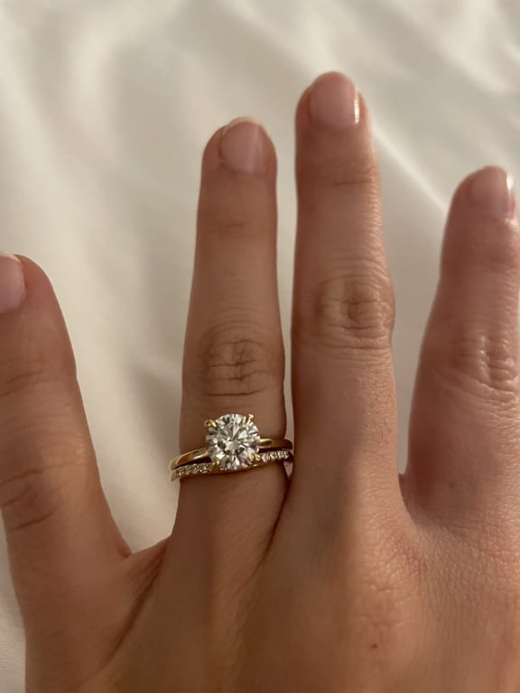 Oval diamond ring on hand