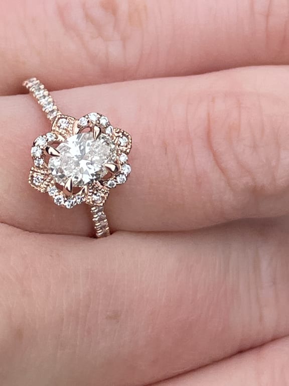 Oval diamond ring on hand