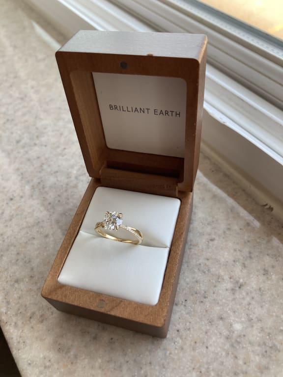 Oval diamond ring on hand