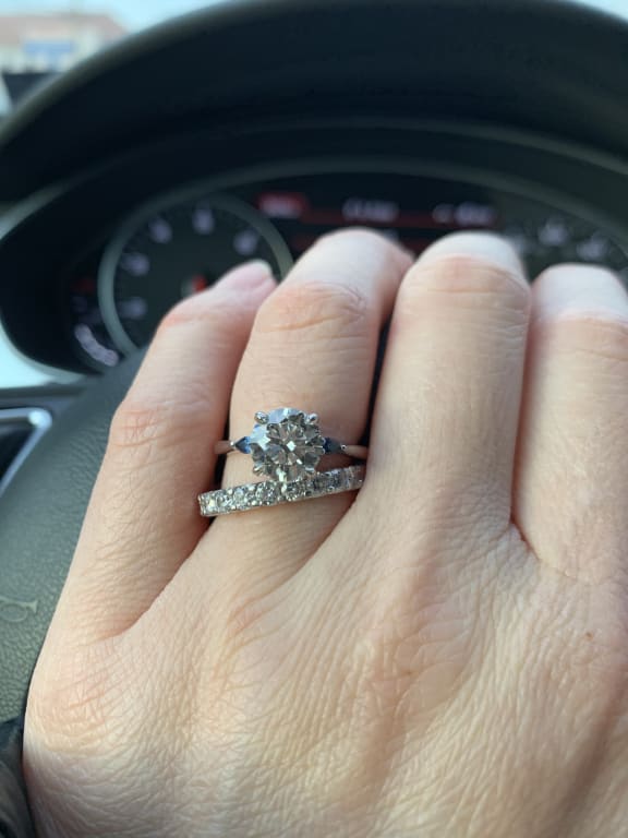 Oval diamond ring on hand