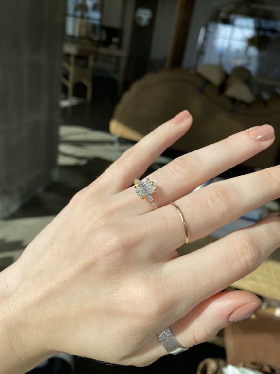Oval diamond ring on hand
