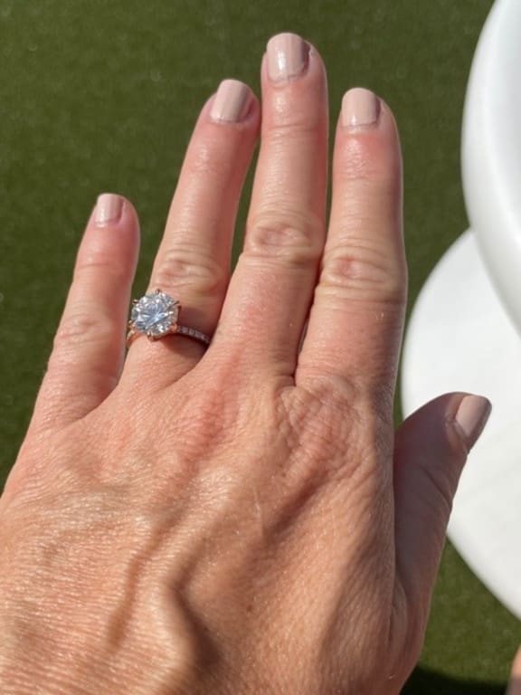 Oval diamond ring on hand