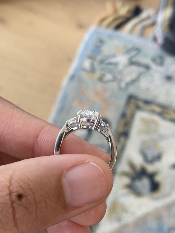 Oval diamond ring on hand