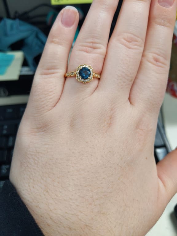 Oval diamond ring on hand