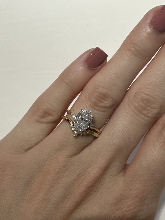 Oval diamond ring on hand