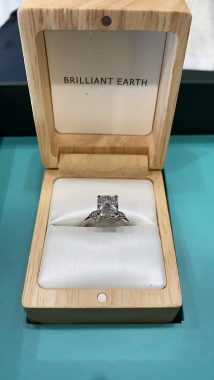Oval diamond ring on hand