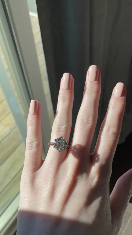 Oval diamond ring on hand