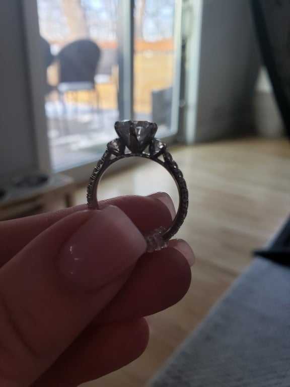 Oval diamond ring on hand