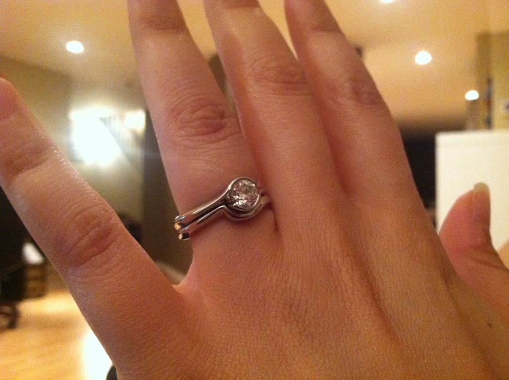 Oval diamond ring on hand