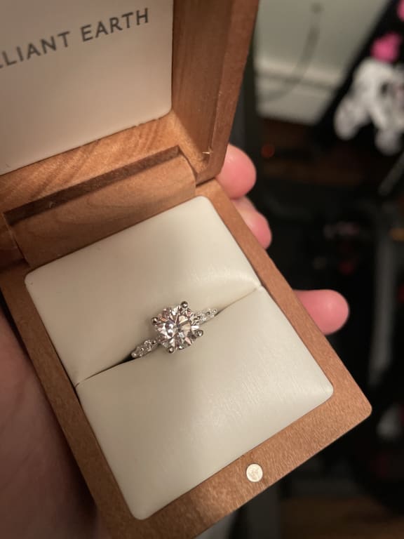 Oval diamond ring on hand