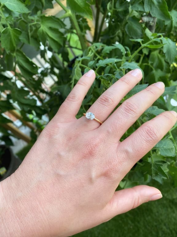 Oval diamond ring on hand