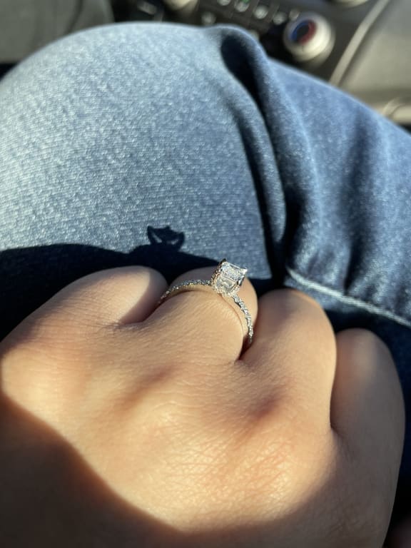 Oval diamond ring on hand