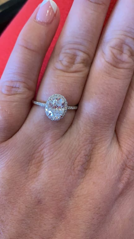 Oval diamond ring on hand