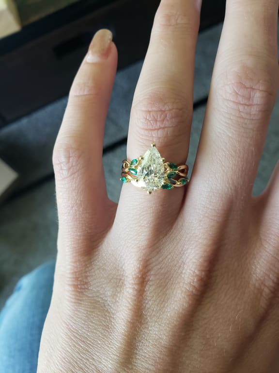 Oval diamond ring on hand