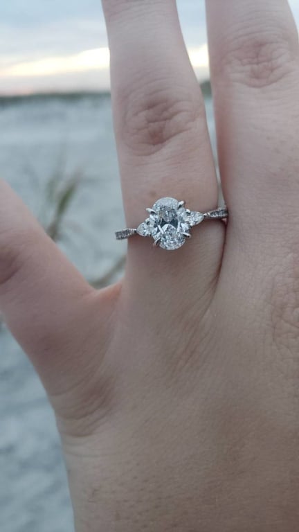 Oval diamond ring on hand