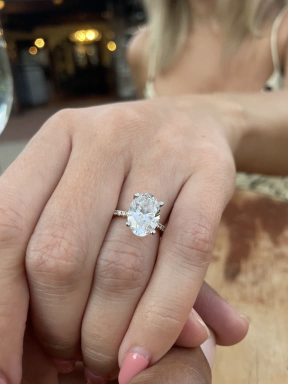 Oval diamond ring on hand