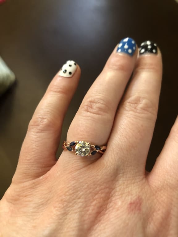 Oval diamond ring on hand