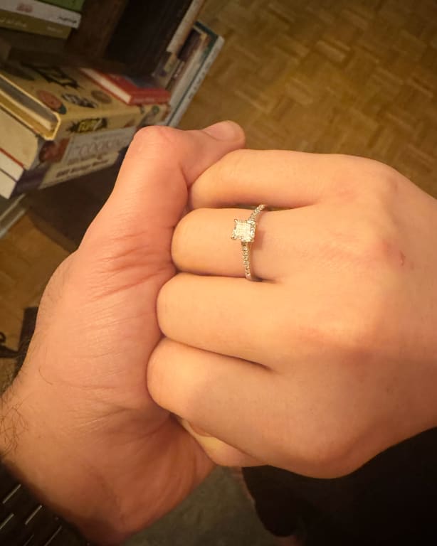 Oval diamond ring on hand