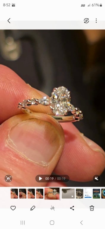 Oval diamond ring on hand