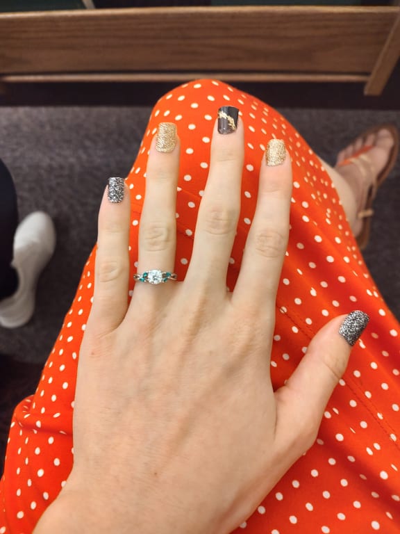 Oval diamond ring on hand