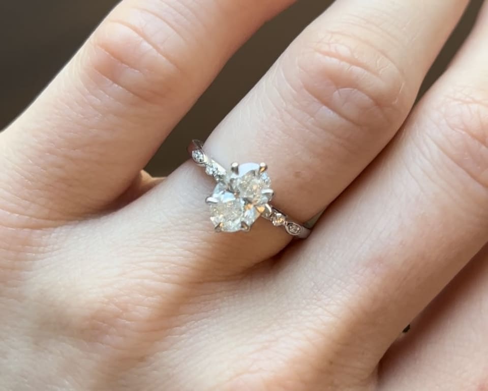 Oval diamond ring on hand