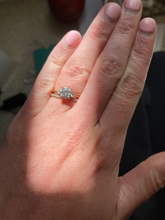 Oval diamond ring on hand