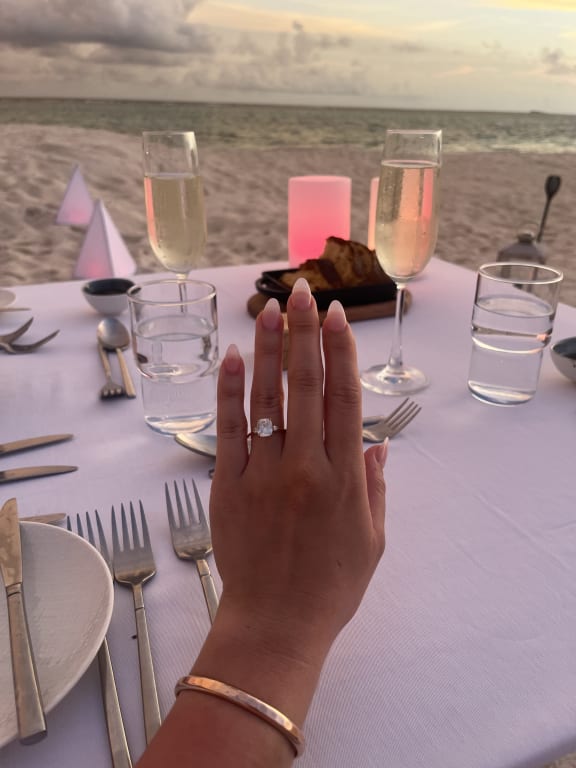 Oval diamond ring on hand