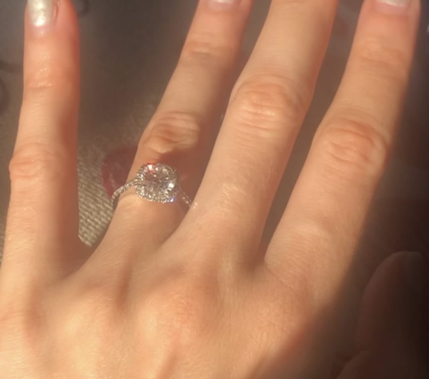 Oval diamond ring on hand