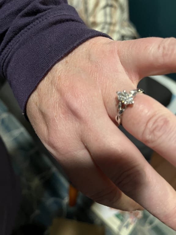 Oval diamond ring on hand