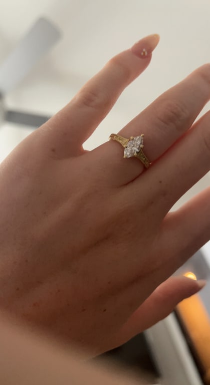 Oval diamond ring on hand