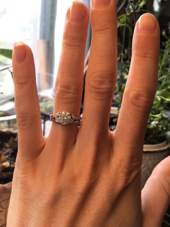 Oval diamond ring on hand