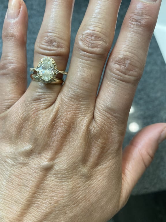 Oval diamond ring on hand