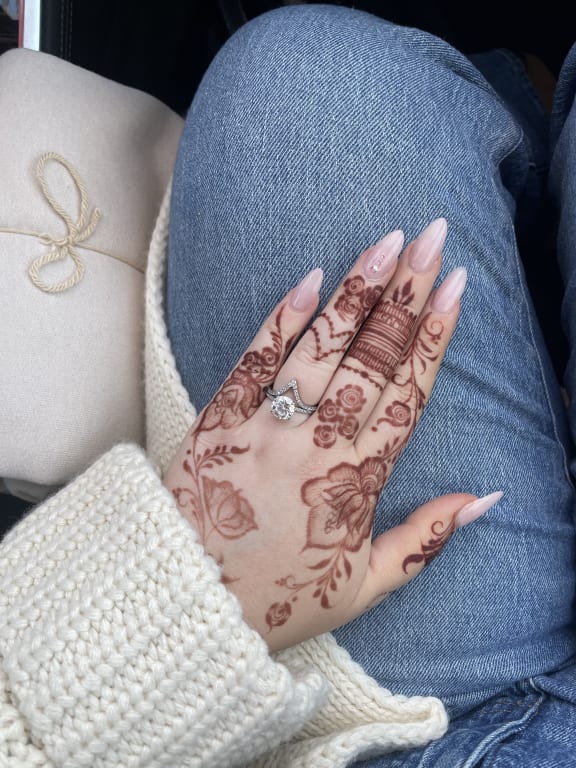Oval diamond ring on hand