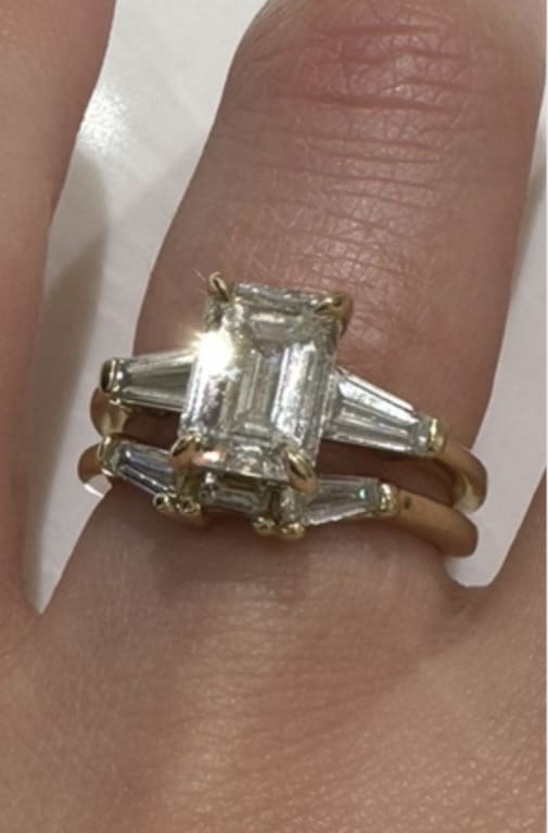 Oval diamond ring on hand