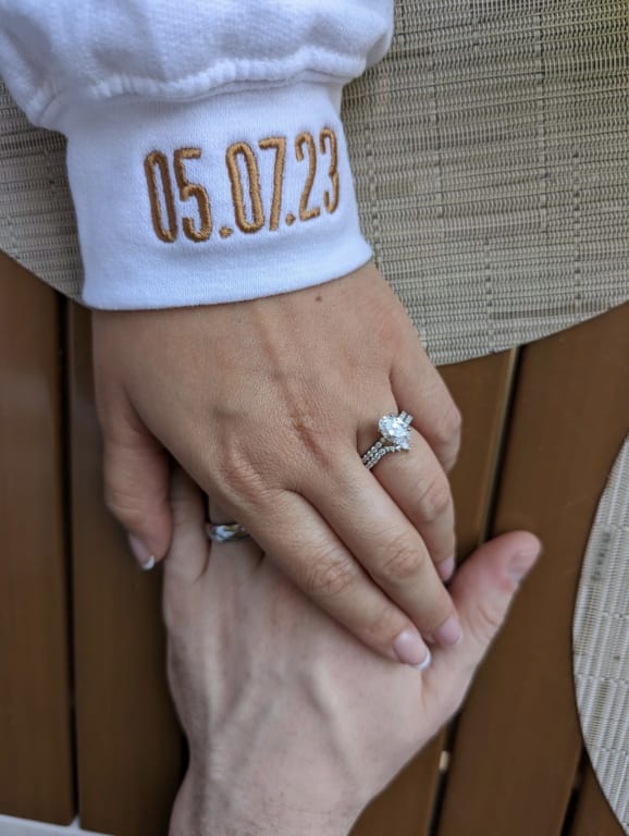 Oval diamond ring on hand