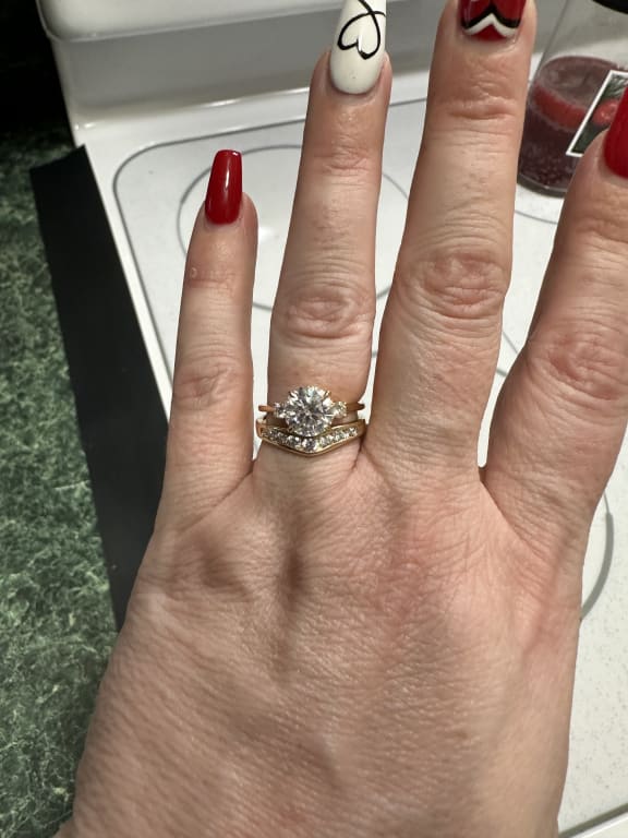 Oval diamond ring on hand