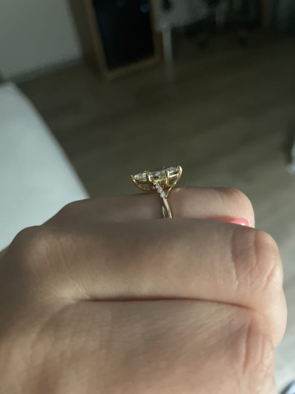Oval diamond ring on hand