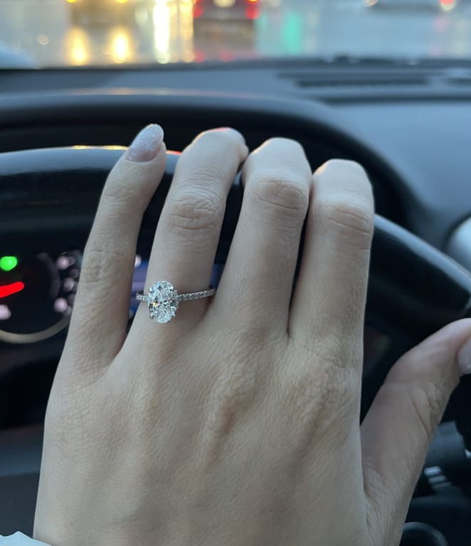 Oval diamond ring on hand