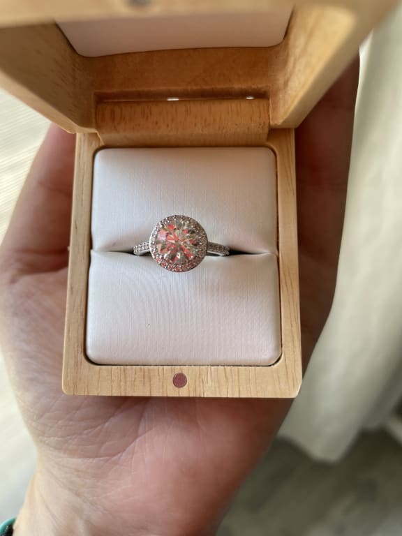 Oval diamond ring on hand