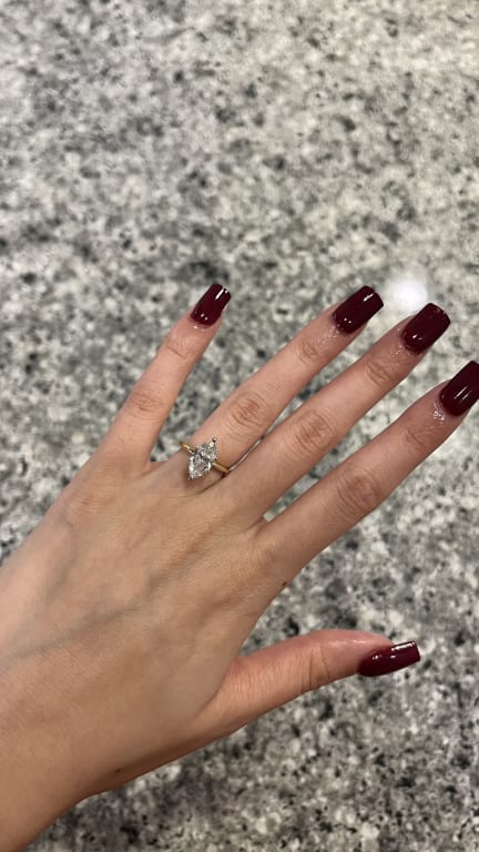 Oval diamond ring on hand