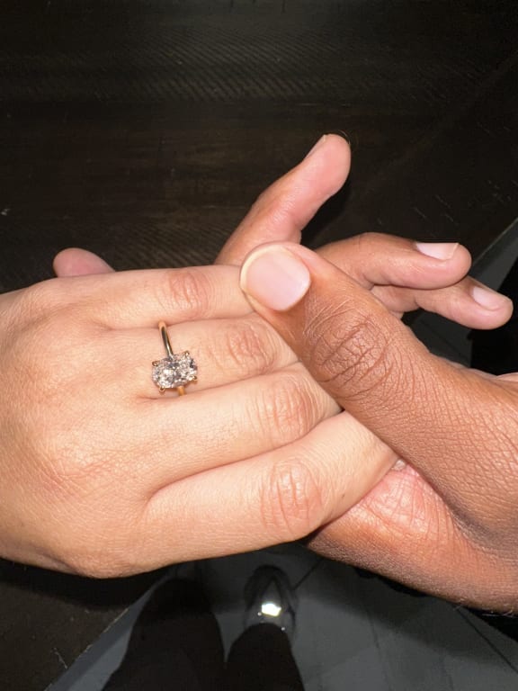 Oval diamond ring on hand