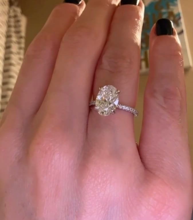 Oval diamond ring on hand