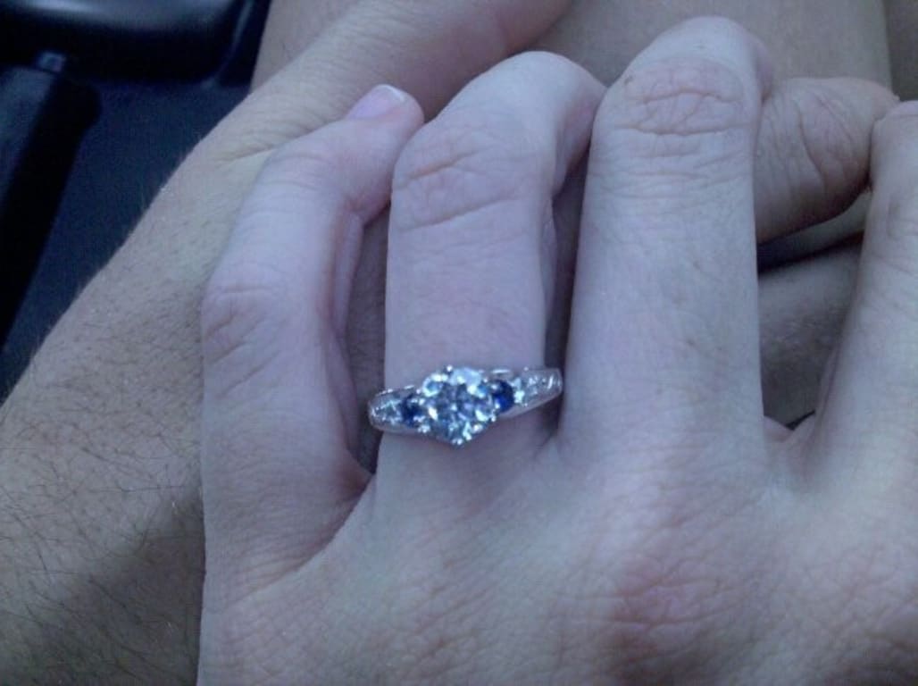 Oval diamond ring on hand