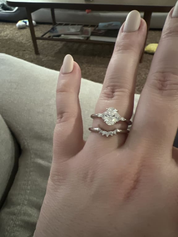 Oval diamond ring on hand