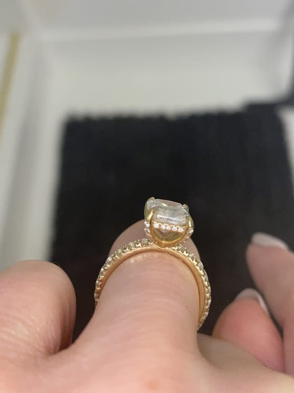 Oval diamond ring on hand