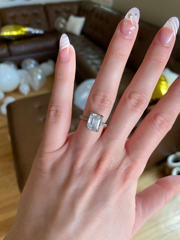 Oval diamond ring on hand